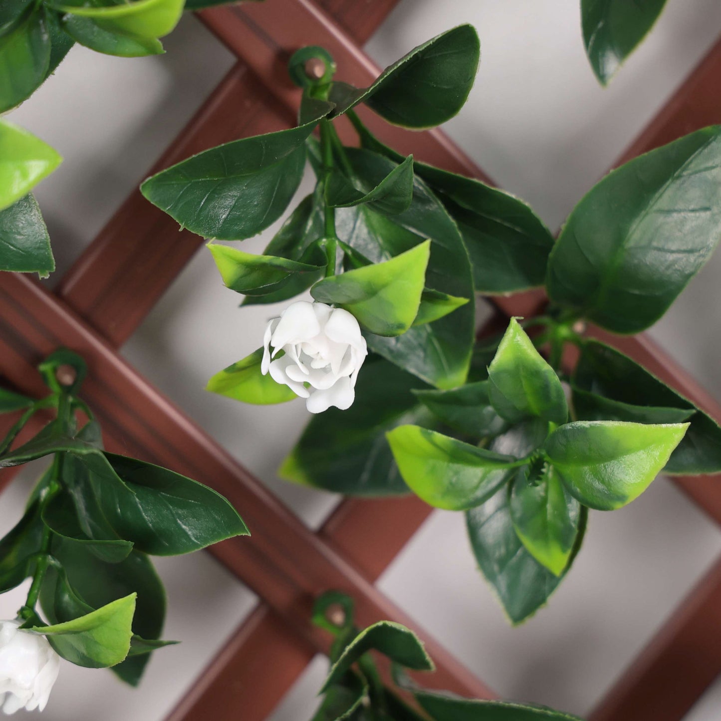 Artificial Laurel & White Flower Expanding PVC Trellis