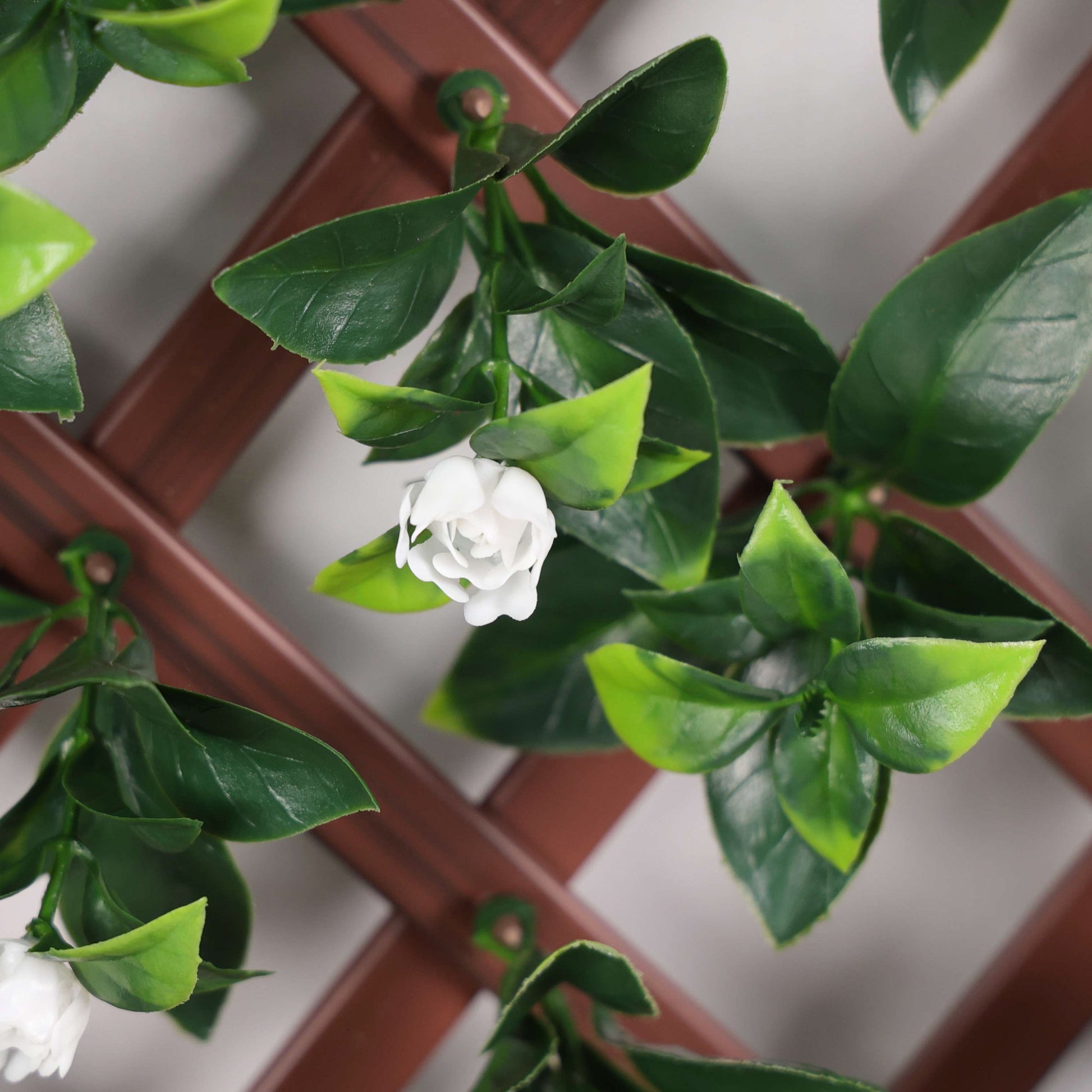 Artificial Laurel & White Flower Expanding PVC Trellis