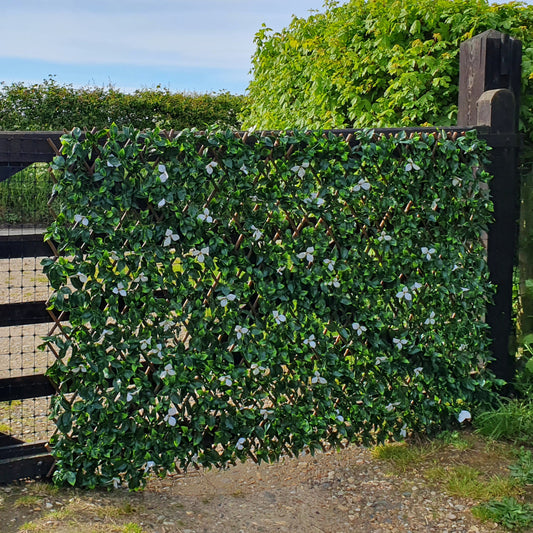 Artificial Laurel & White Flower Expanding Willow Trellis Fence